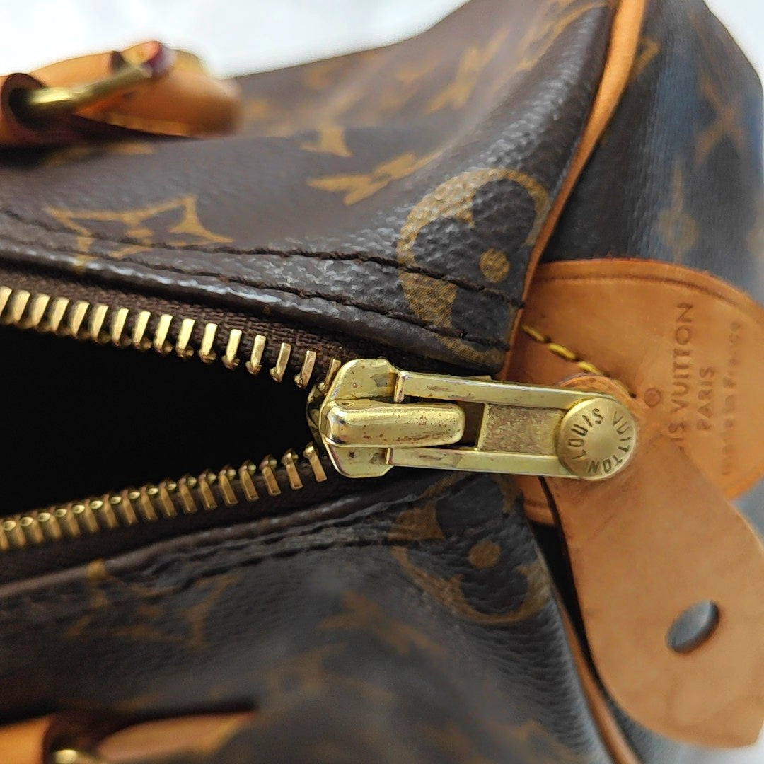 Authenticated pre-owned  SPEEDY 25 Monogram Coated Canvas Brown - Top Handle Bag at Looply