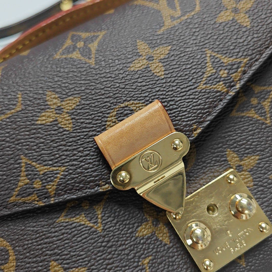 MÉTIS EAST WEST Monogram Coated Canvas Brown