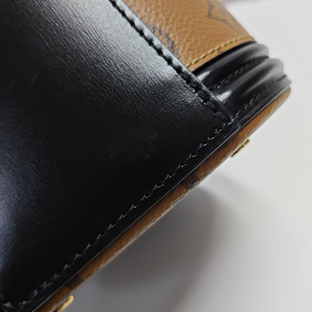 CANNES PM Monogram Coated Canvas Brown