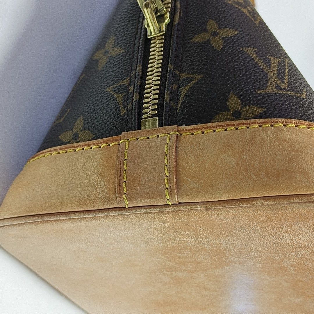 ALMA PM Monogram Coated Canvas Brown