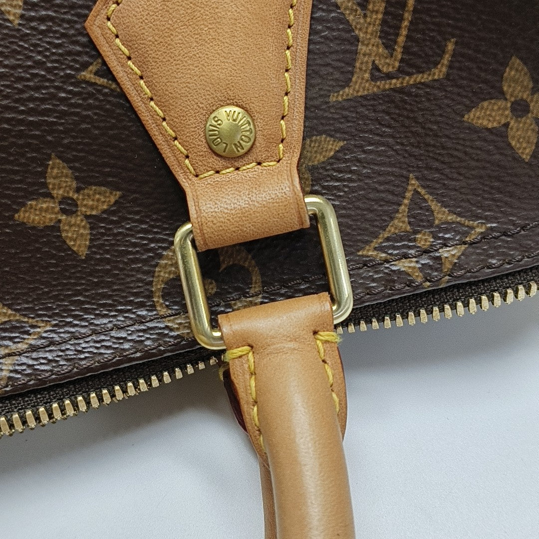 SPEEDY 25 Monogram Coated Canvas Brown