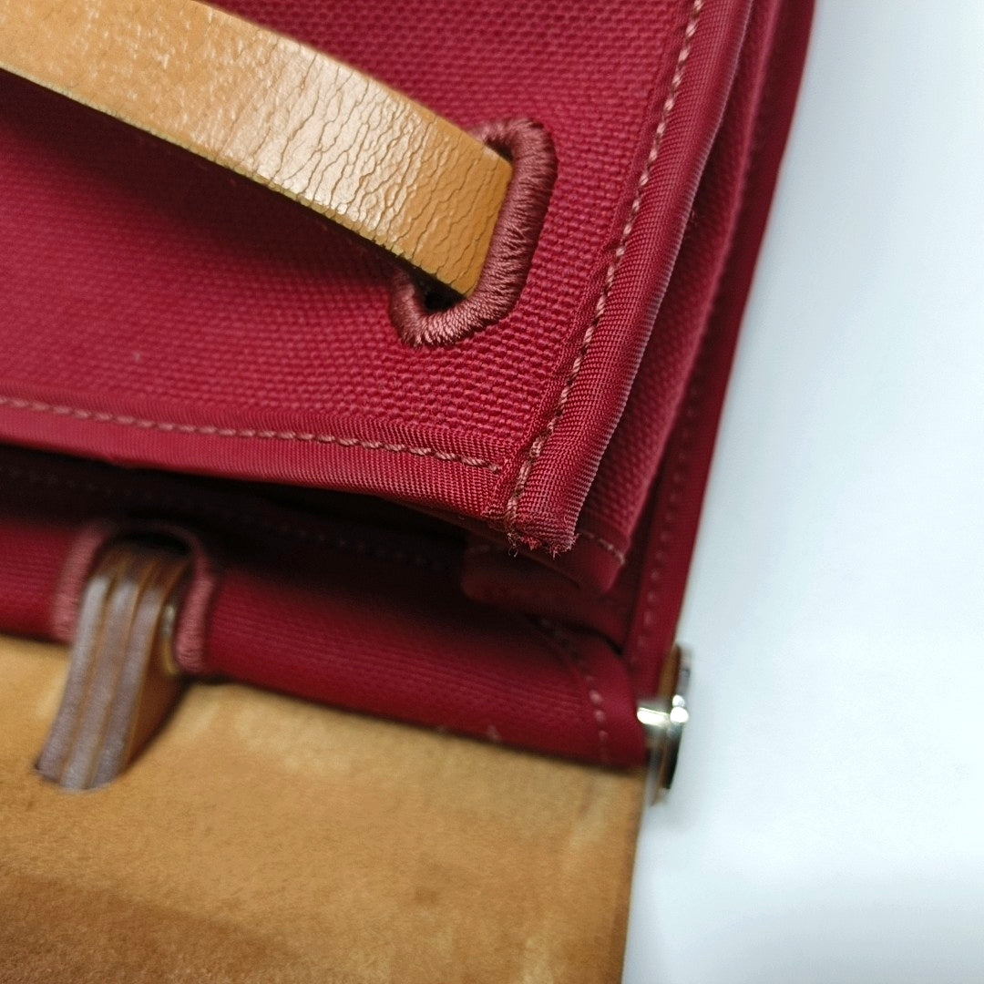 Authenticated pre-owned  Herbag 31 Canvas Red - Shoulder Bag at Looply