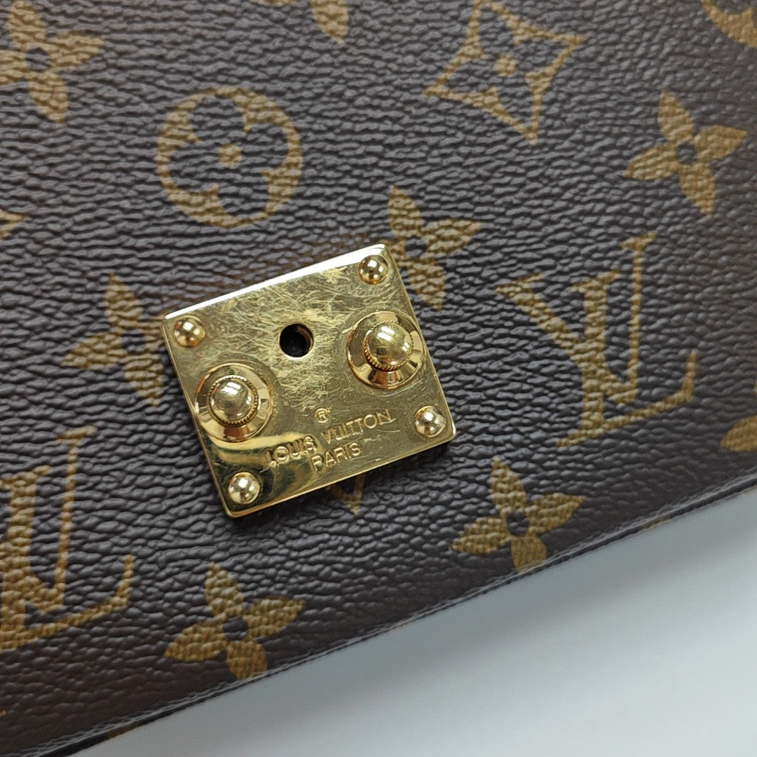 MÉTIS EAST WEST Monogram Coated Canvas Brown