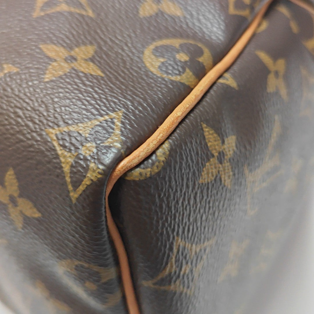SPEEDY 25 Monogram Coated Canvas Brown