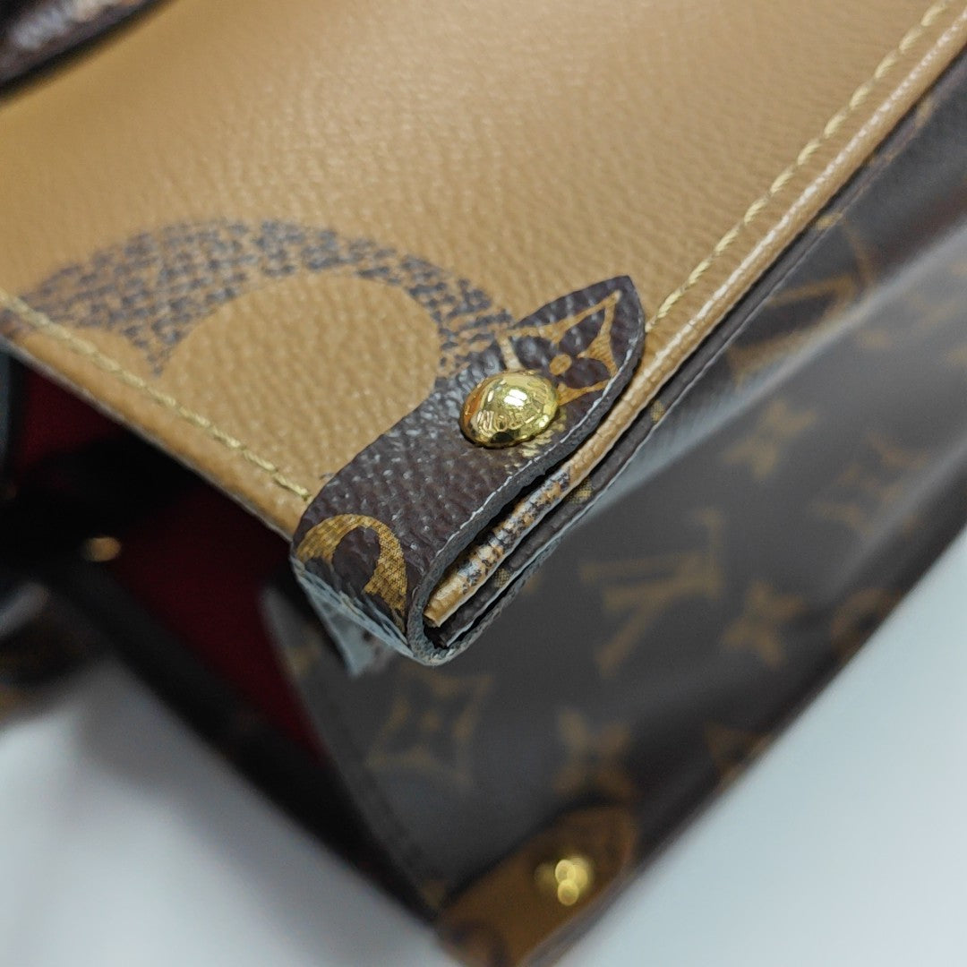 ONTHEGO MM Monogram Coated Canvas Brown