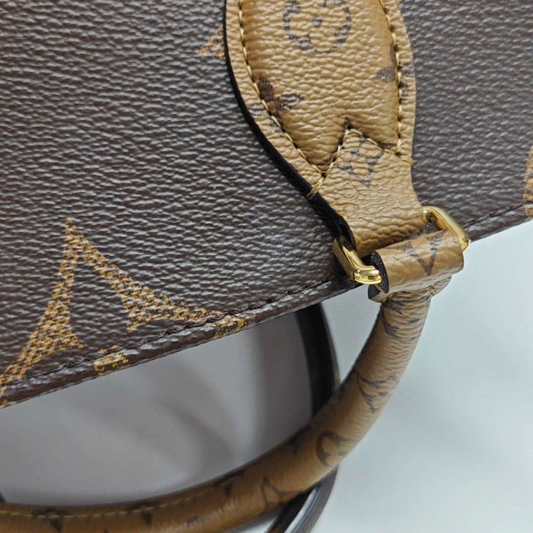 ONTHEGO PM Monogram Coated Canvas Brown