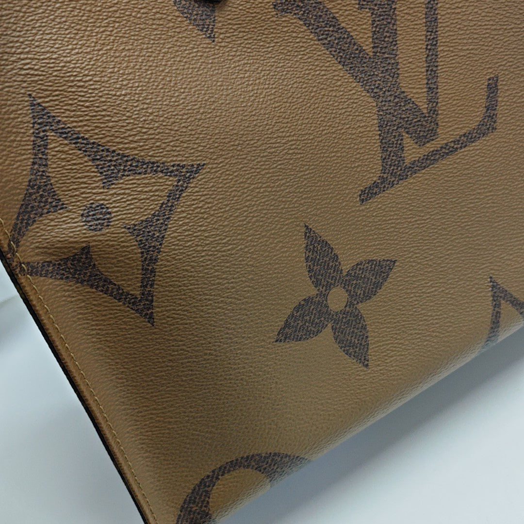 ONTHEGO MM Monogram Coated Canvas Brown