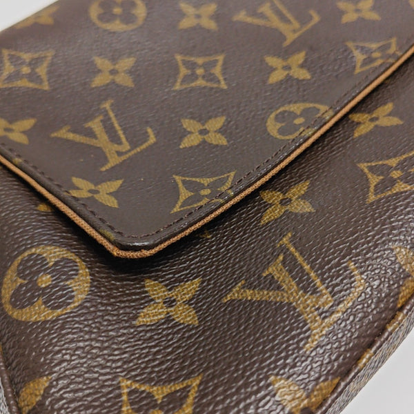 LOOPING PM Monogram Coated Canvas Brown