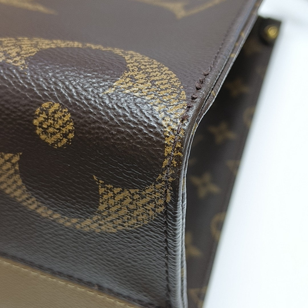 ONTHEGO MM Monogram Coated Canvas Brown