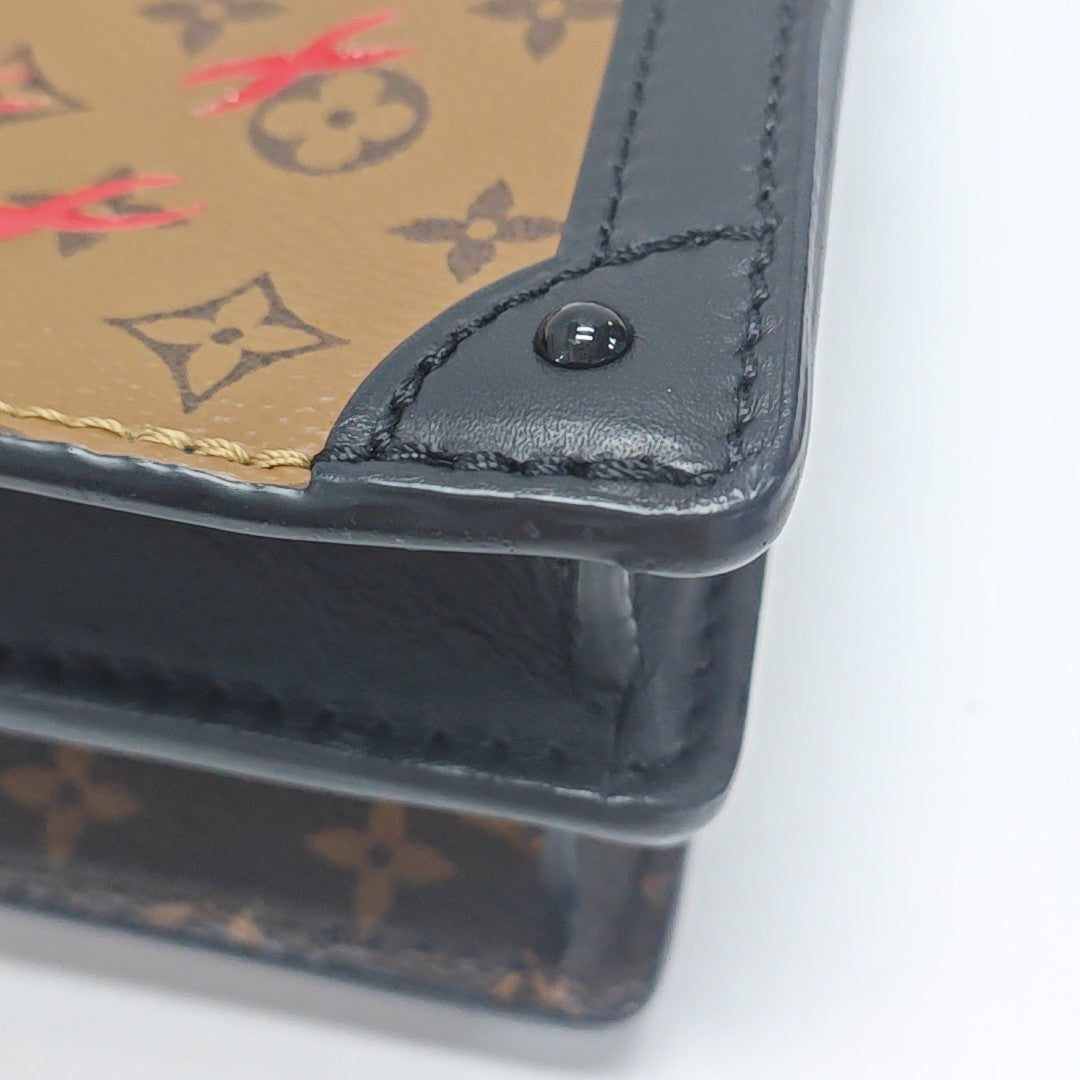 TRUNK Monogram Coated Canvas Brown