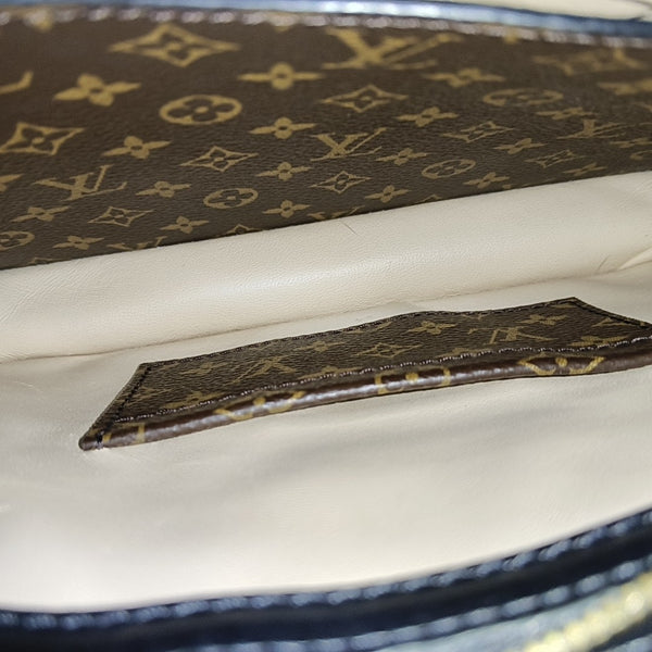 TRUNK Monogram Coated Canvas Brown
