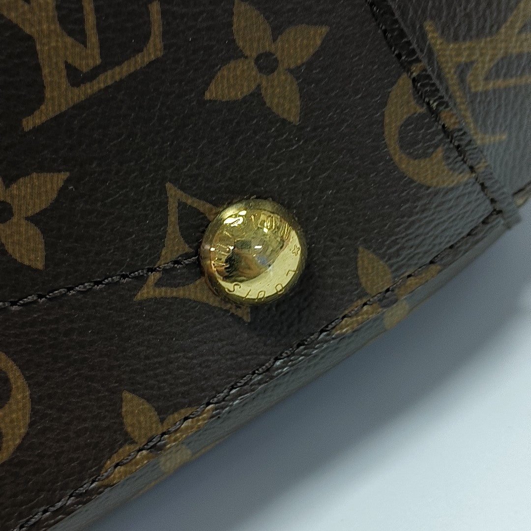 MONTAIGNE GM Monogram Coated Canvas Brown