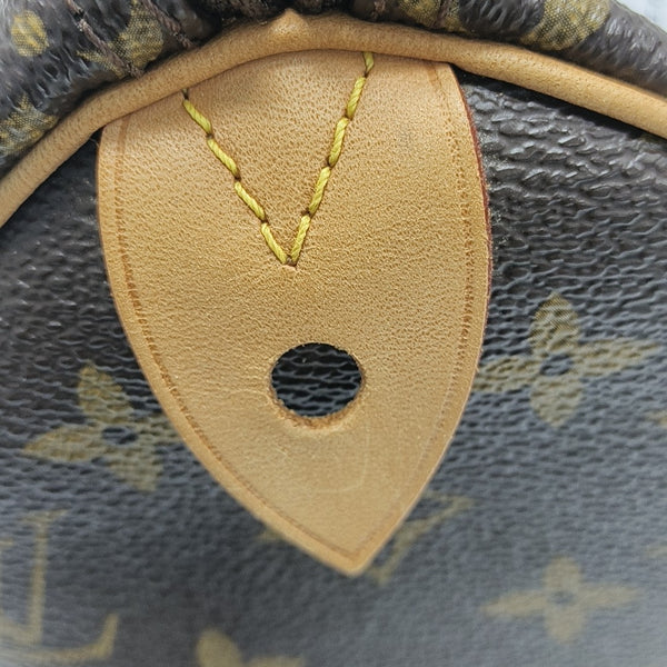 SPEEDY 25 Monogram Coated Canvas Brown