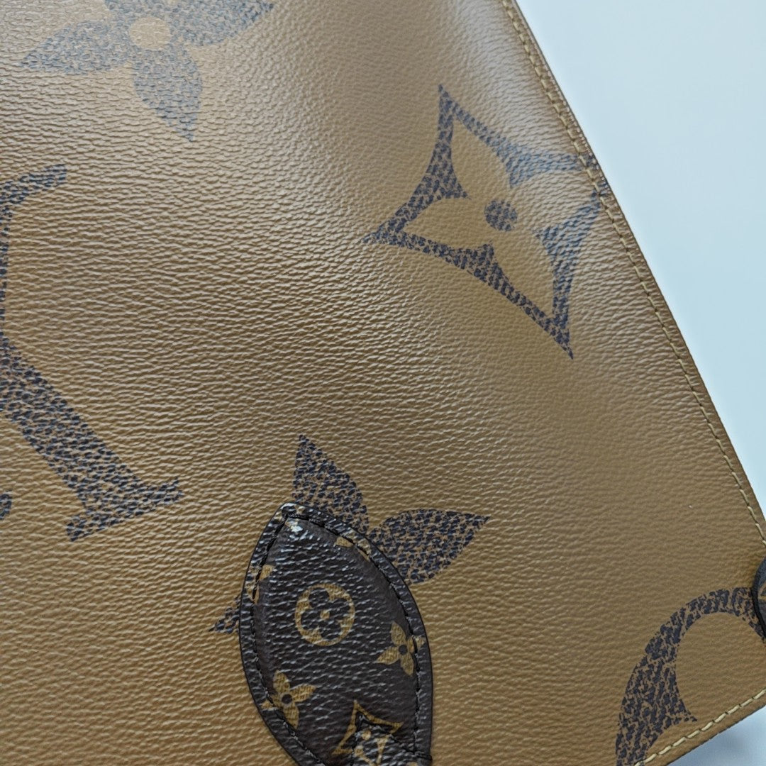 ONTHEGO MM Monogram Coated Canvas Brown