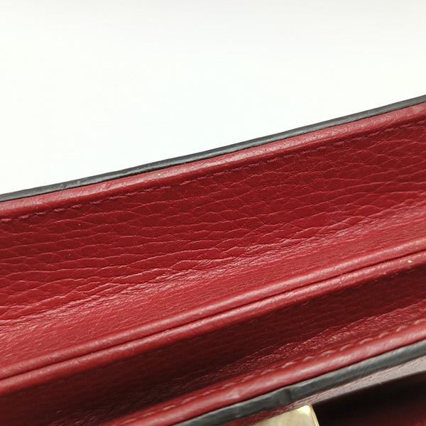 Piel de becerro roja pequeña con GG entrelazadas