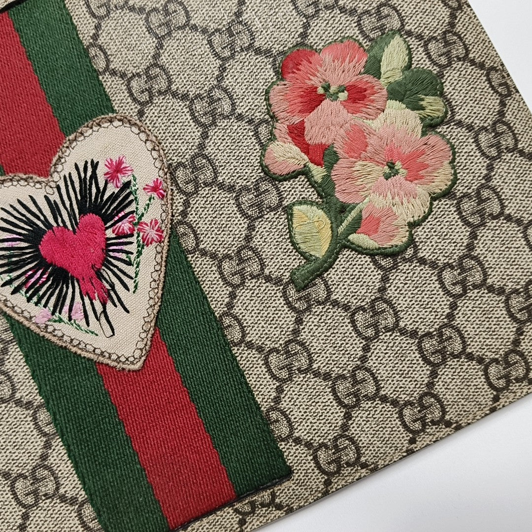 Monogram Coated Canvas Clutch Beige