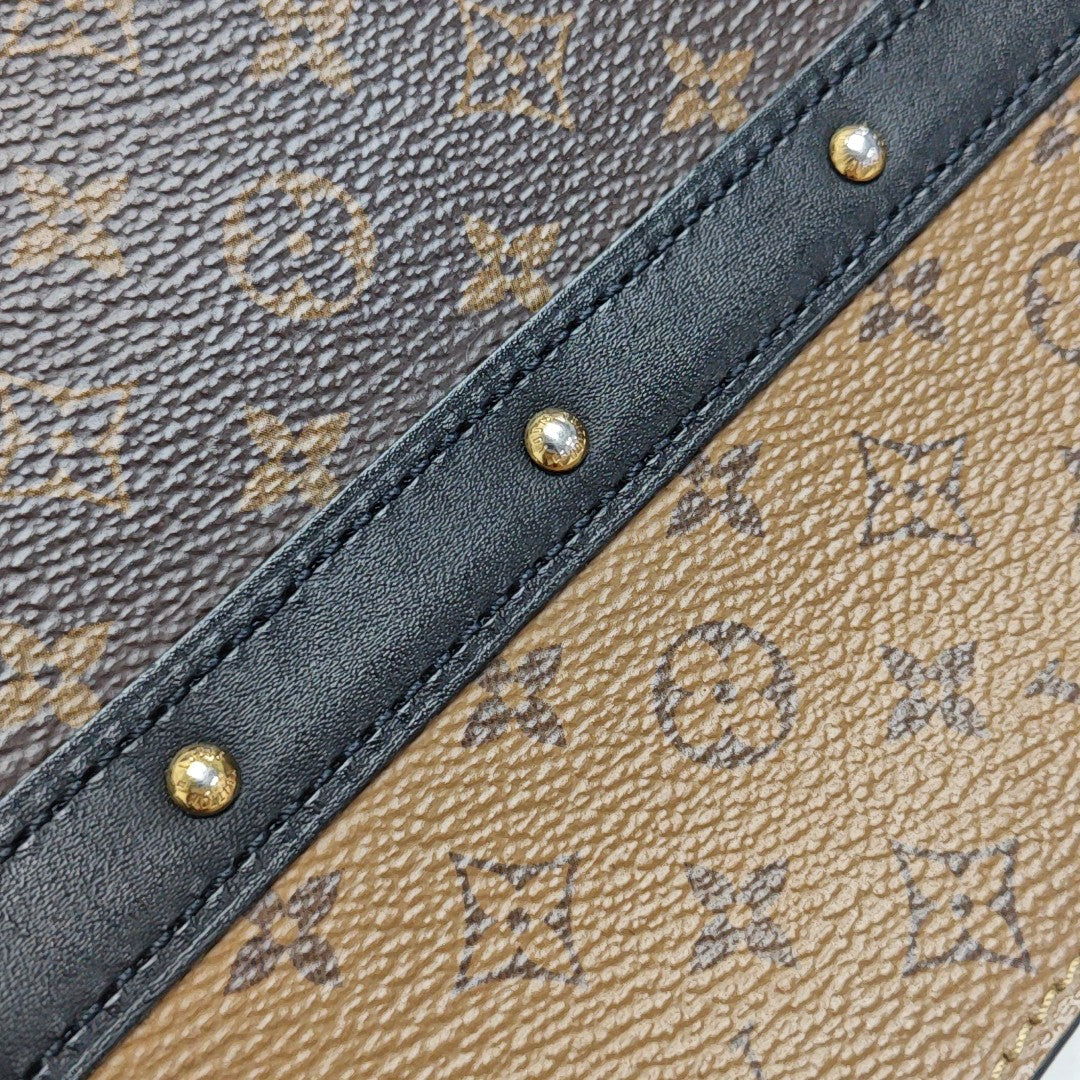TRUNK Monogram Coated Canvas Brown