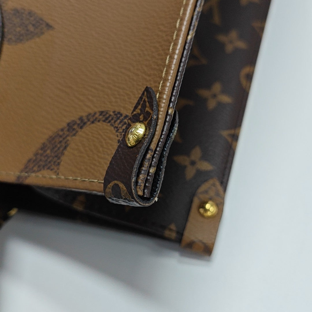 ONTHEGO MM Monogram Coated Canvas Brown