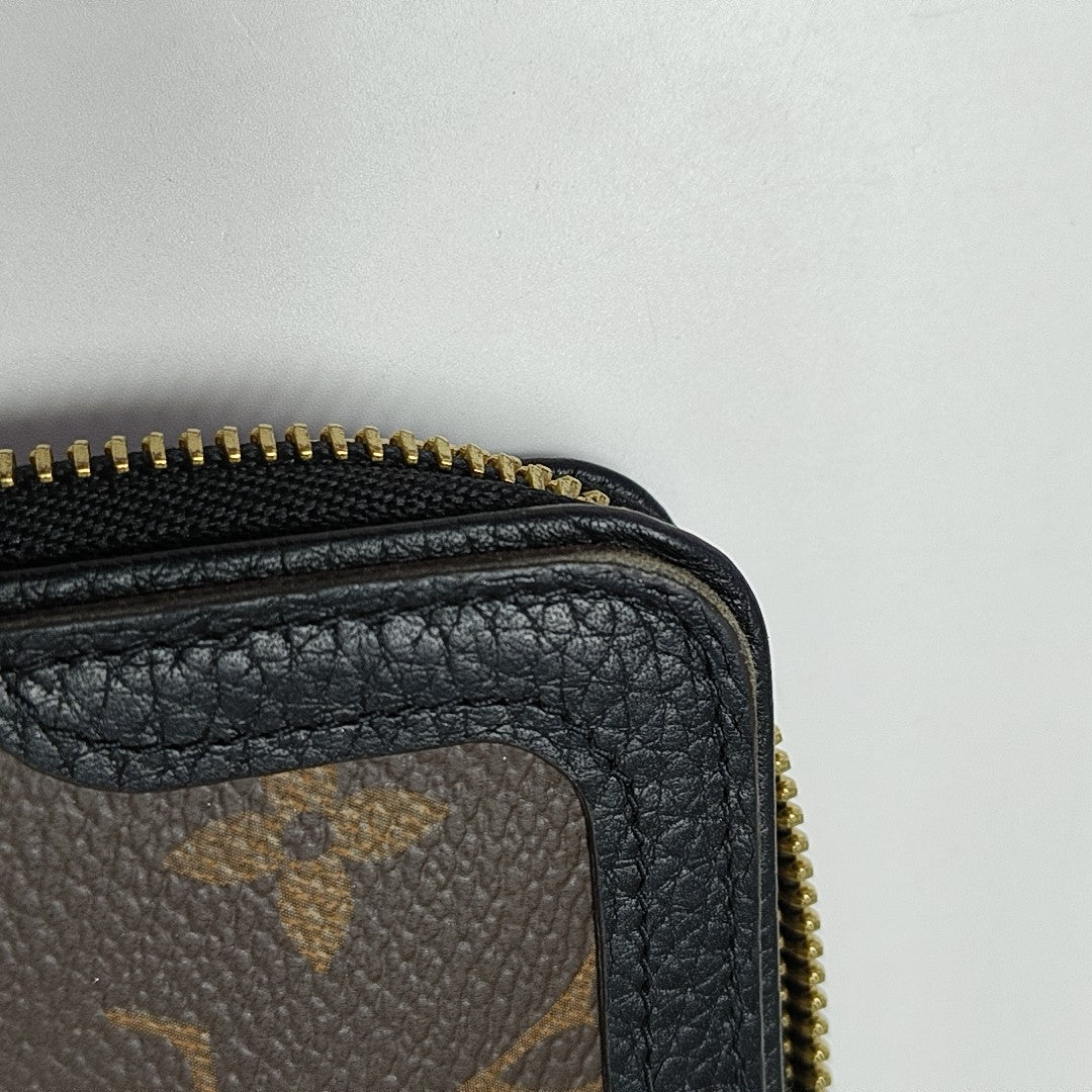 Monogram Coated Canvas Clutch Brown