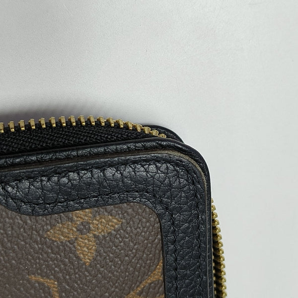 Monogram Coated Canvas Clutch Brown