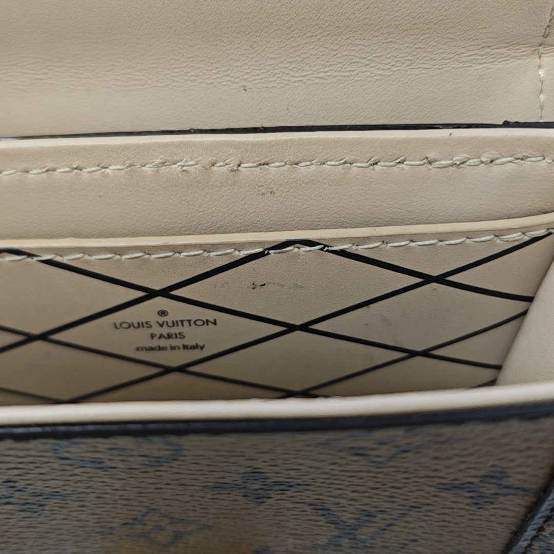 TRUNK Monogram Coated Canvas Brown