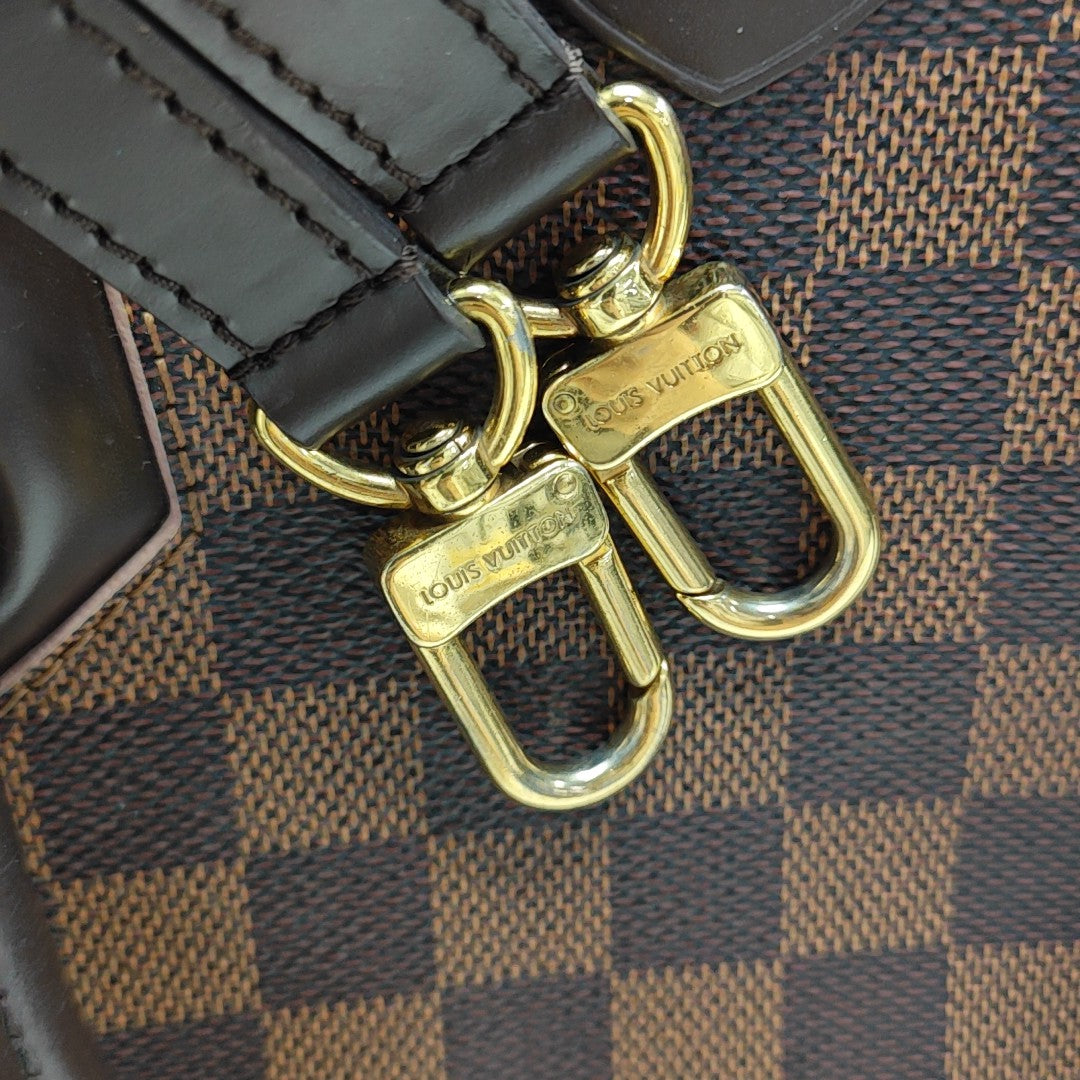 CAÏSSA PM Damier Ebene Coated Canvas Brown