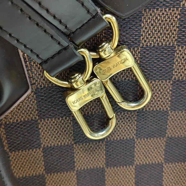 CAÏSSA PM Damier Ebene Coated Canvas Brown