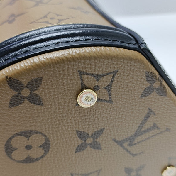 CANNES PM Monogram Coated Canvas Brown