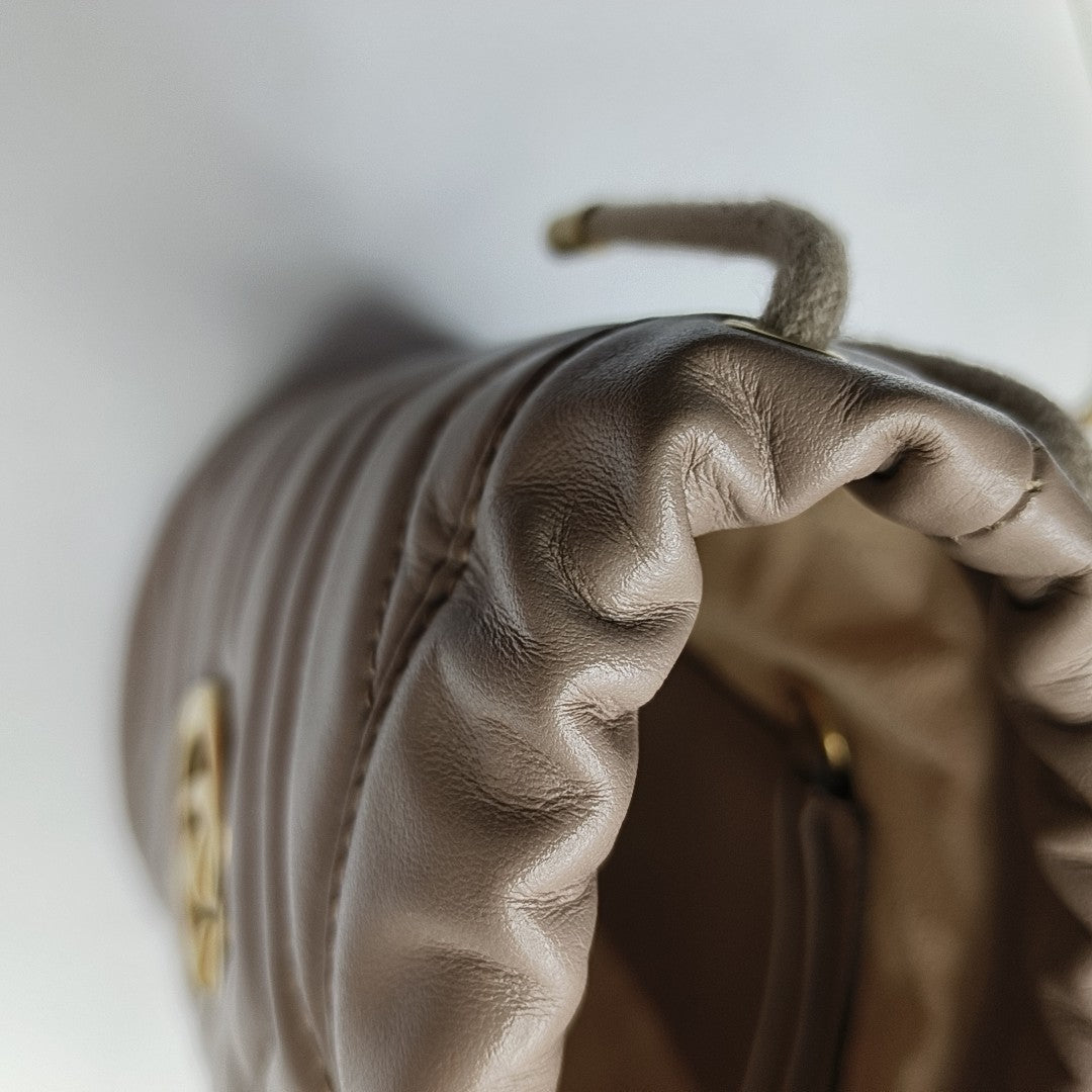 Authenticated pre-owned  GG Marmont Mini Quilted Calfskin Beige - Bucket Bag at Looply