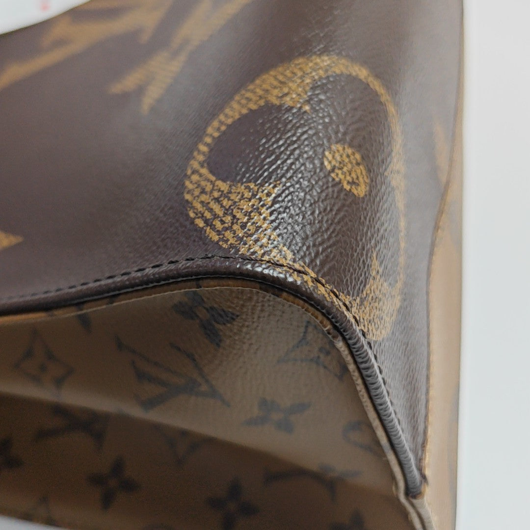 ONTHEGO MM Monogram Coated Canvas Brown