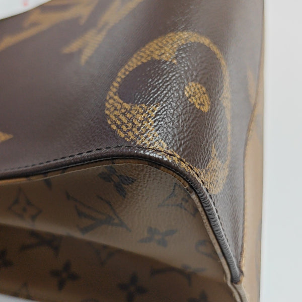 ONTHEGO MM Monogram Coated Canvas Brown