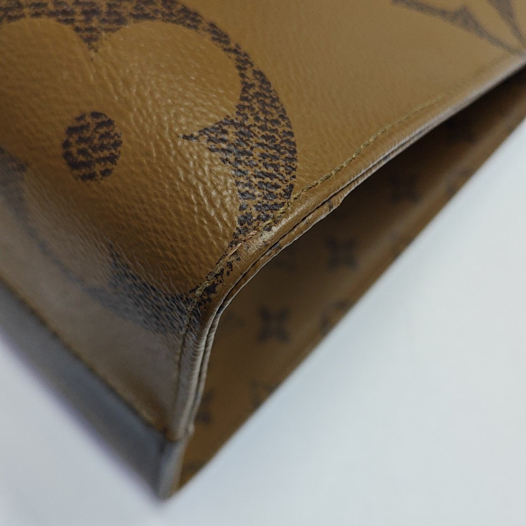 ONTHEGO MM Monogram Coated Canvas Brown