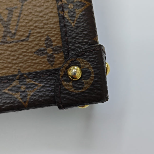 TRUNK Monogram Coated Canvas Brown