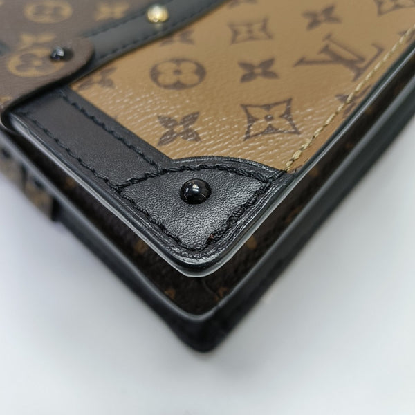 TRUNK Monogram Coated Canvas Brown