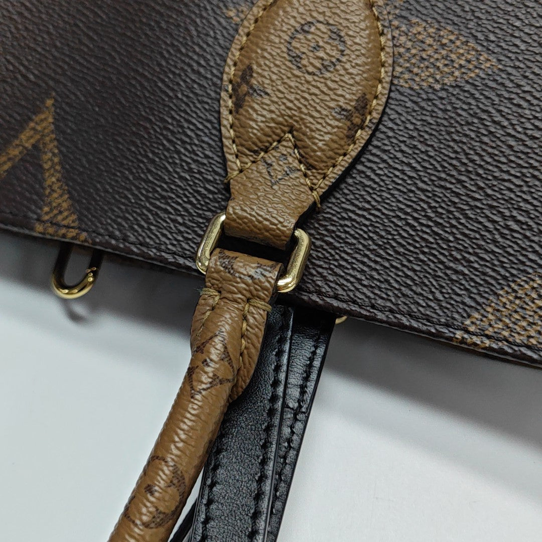 ONTHEGO MM Monogram Coated Canvas Brown