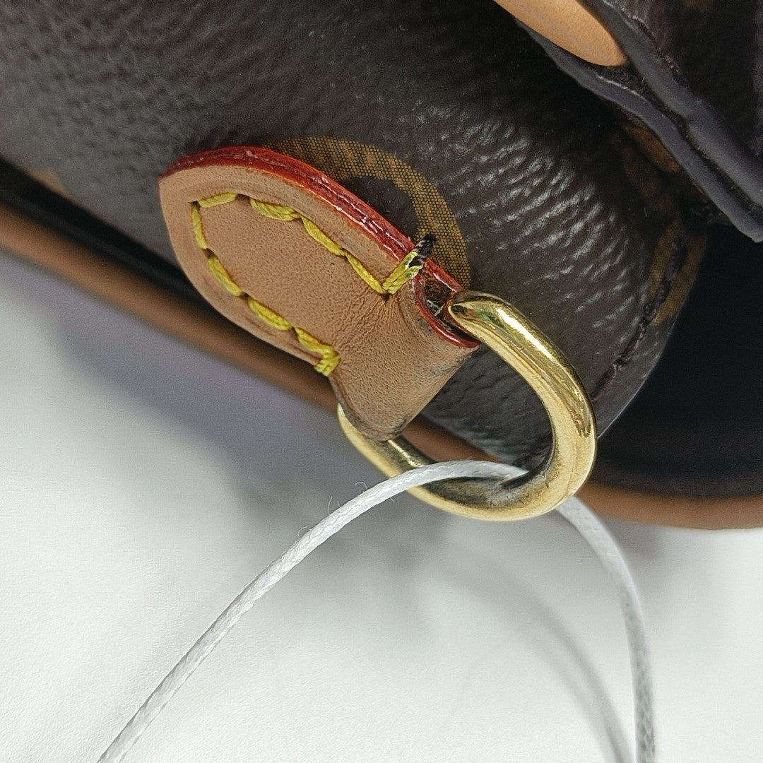 Pochette Camille Monogram Coated Canvas Brown