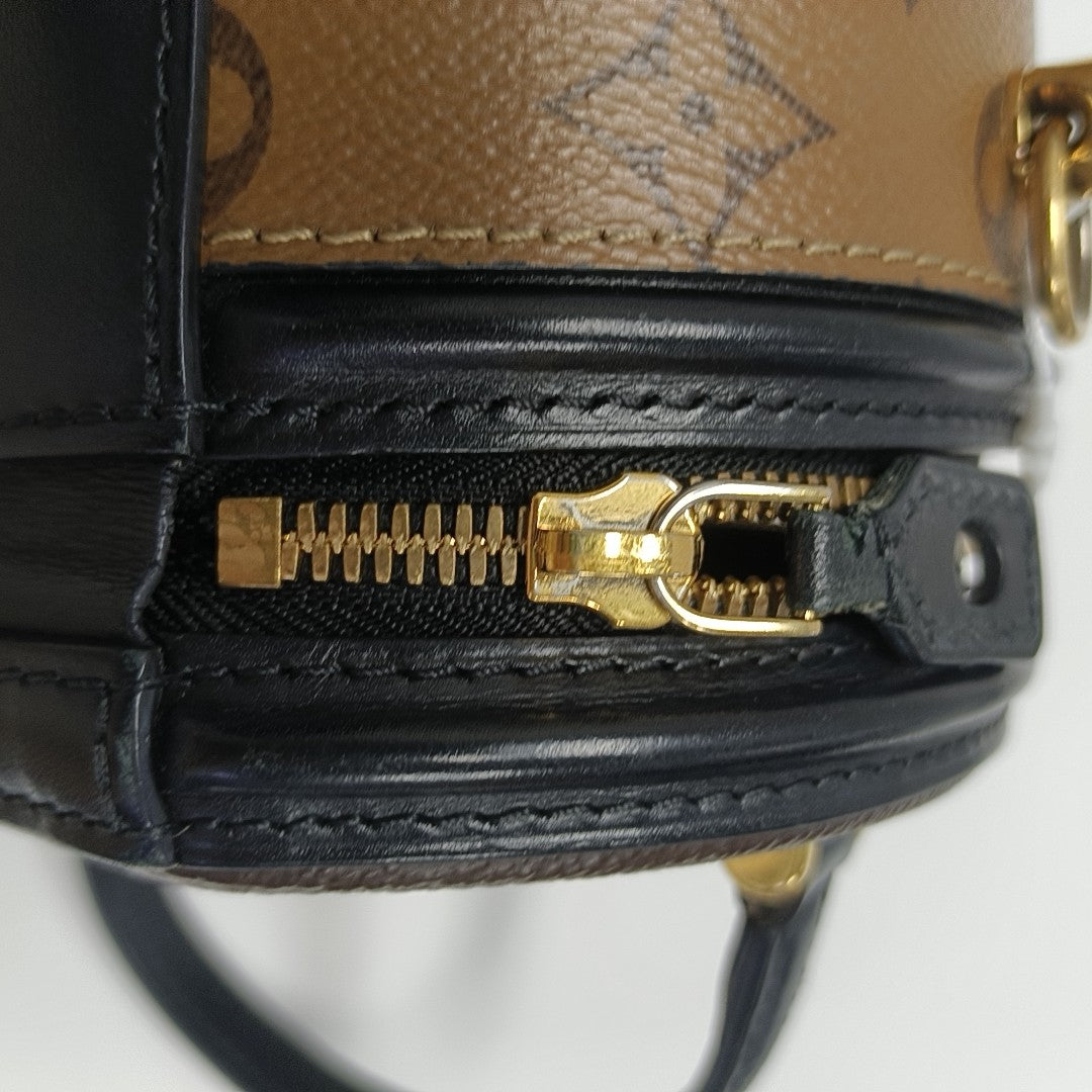 CANNES PM Monogram Coated Canvas Brown