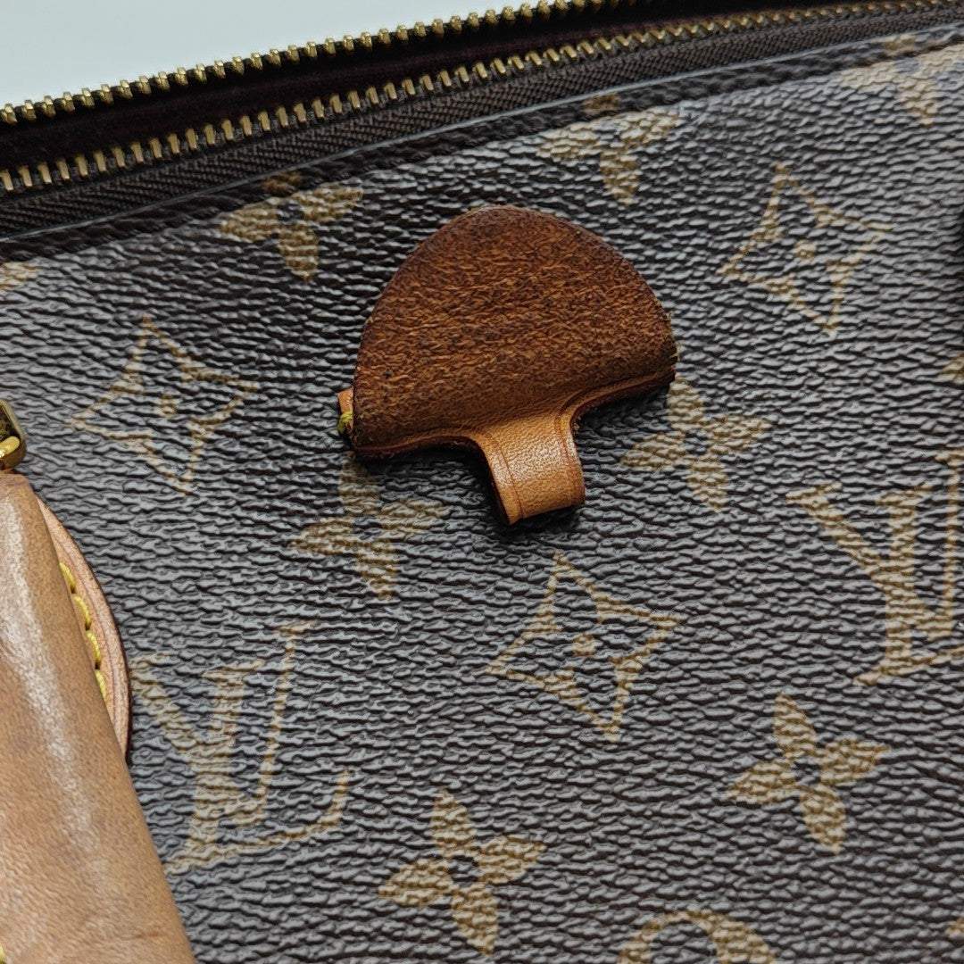 RIVOLI MM Monogram Coated Canvas Brown