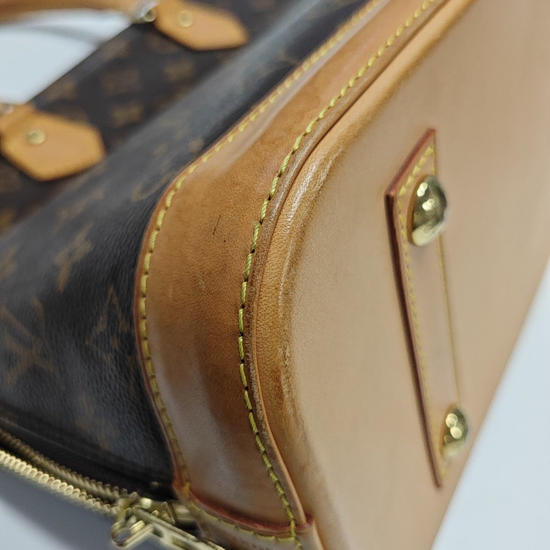 ALMA PM Monogram Coated Canvas Brown