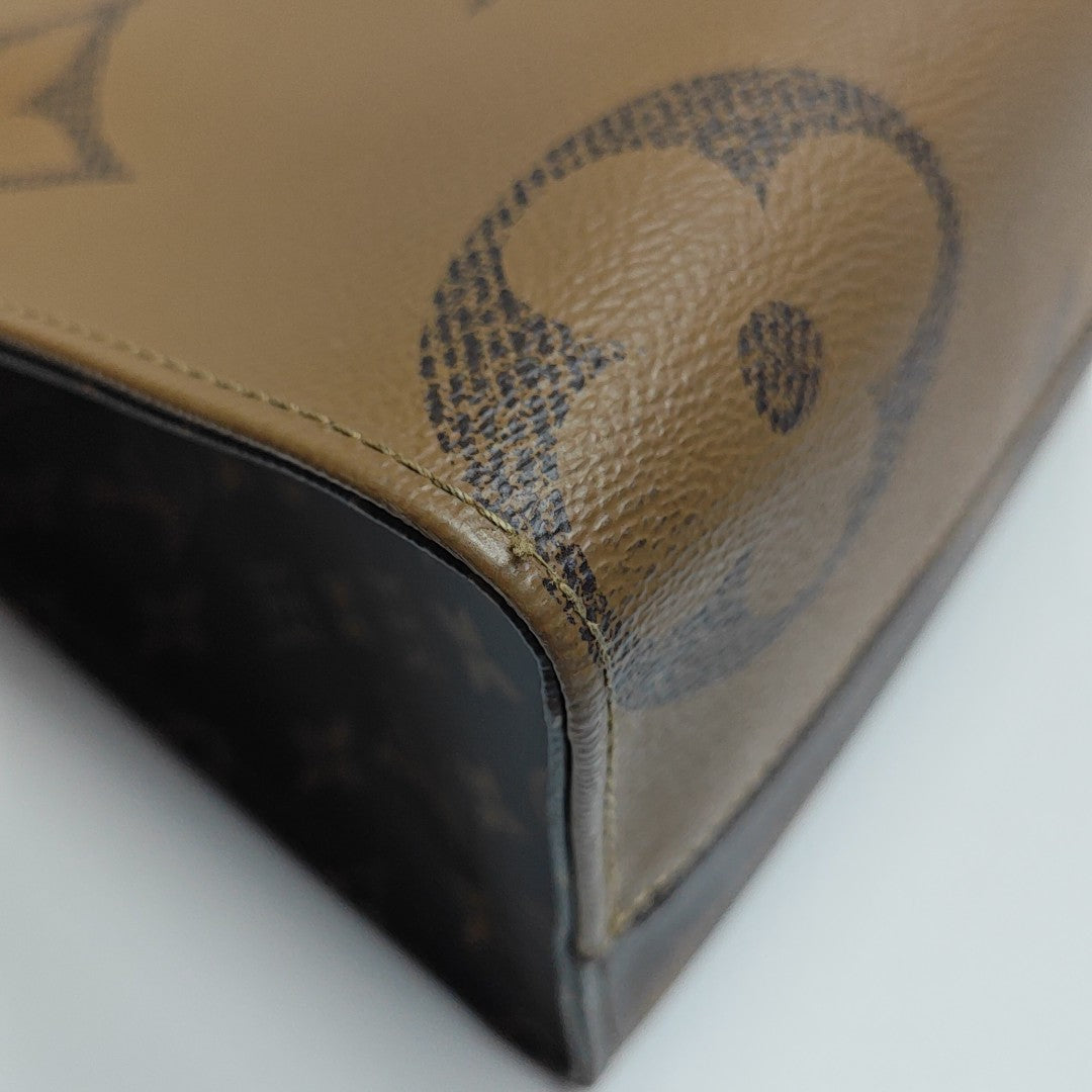 ONTHEGO MM Monogram Coated Canvas Brown