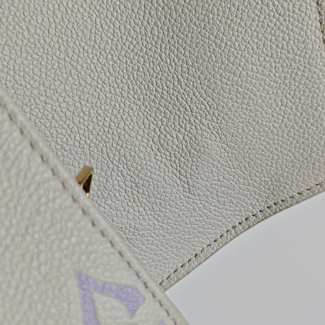 MÉTIS EAST WEST Monogram Calfskin White