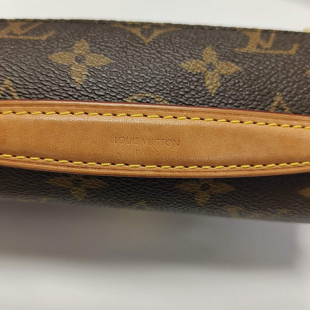 MÉTIS EAST WEST Monogram Coated Canvas Brown