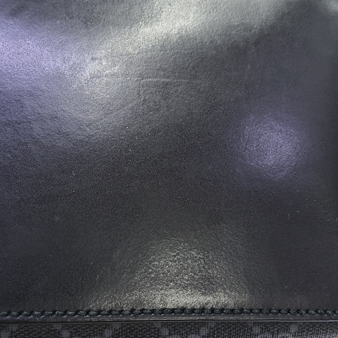 Monogram Coated Canvas Backpack Black