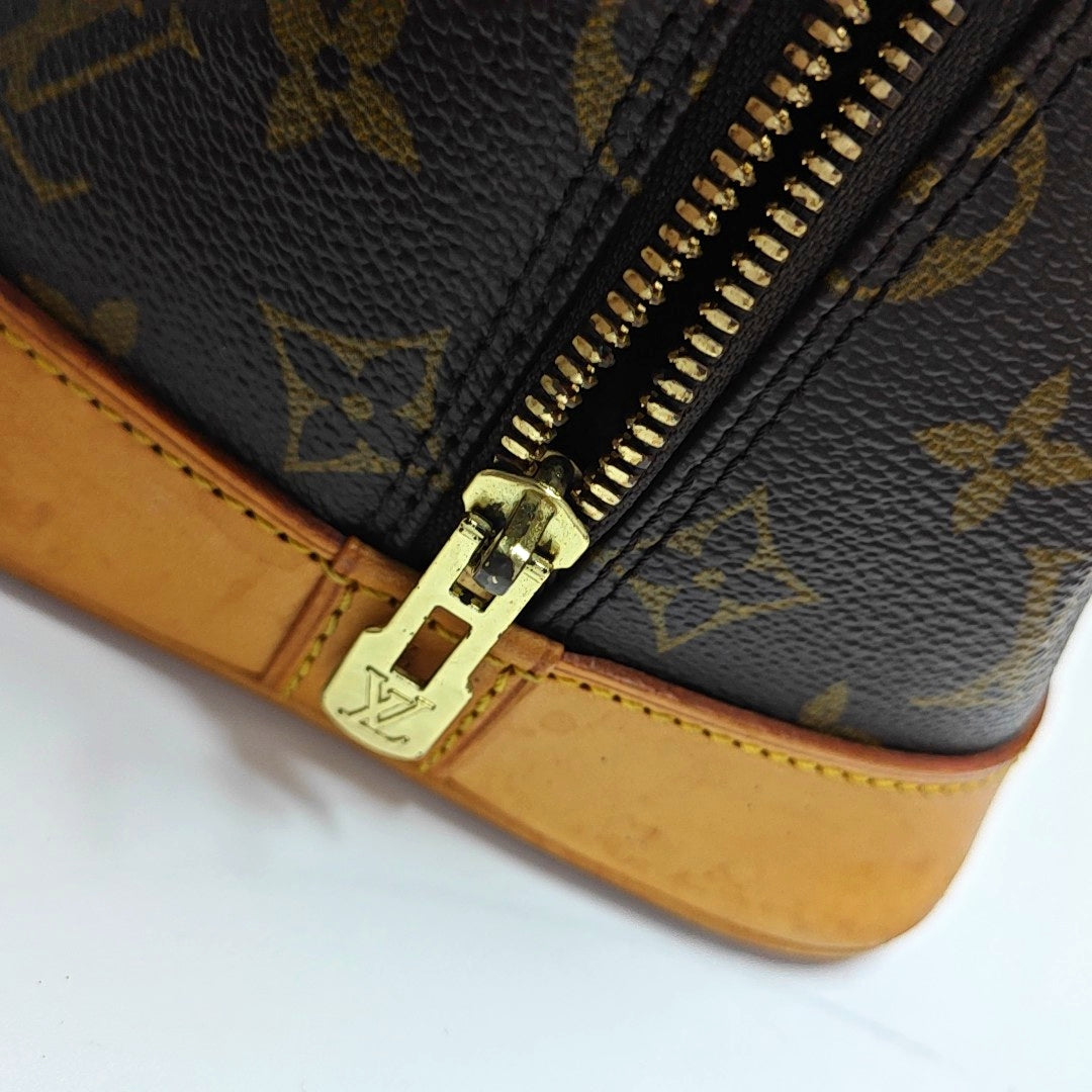 ALMA PM Monogram Coated Canvas Brown
