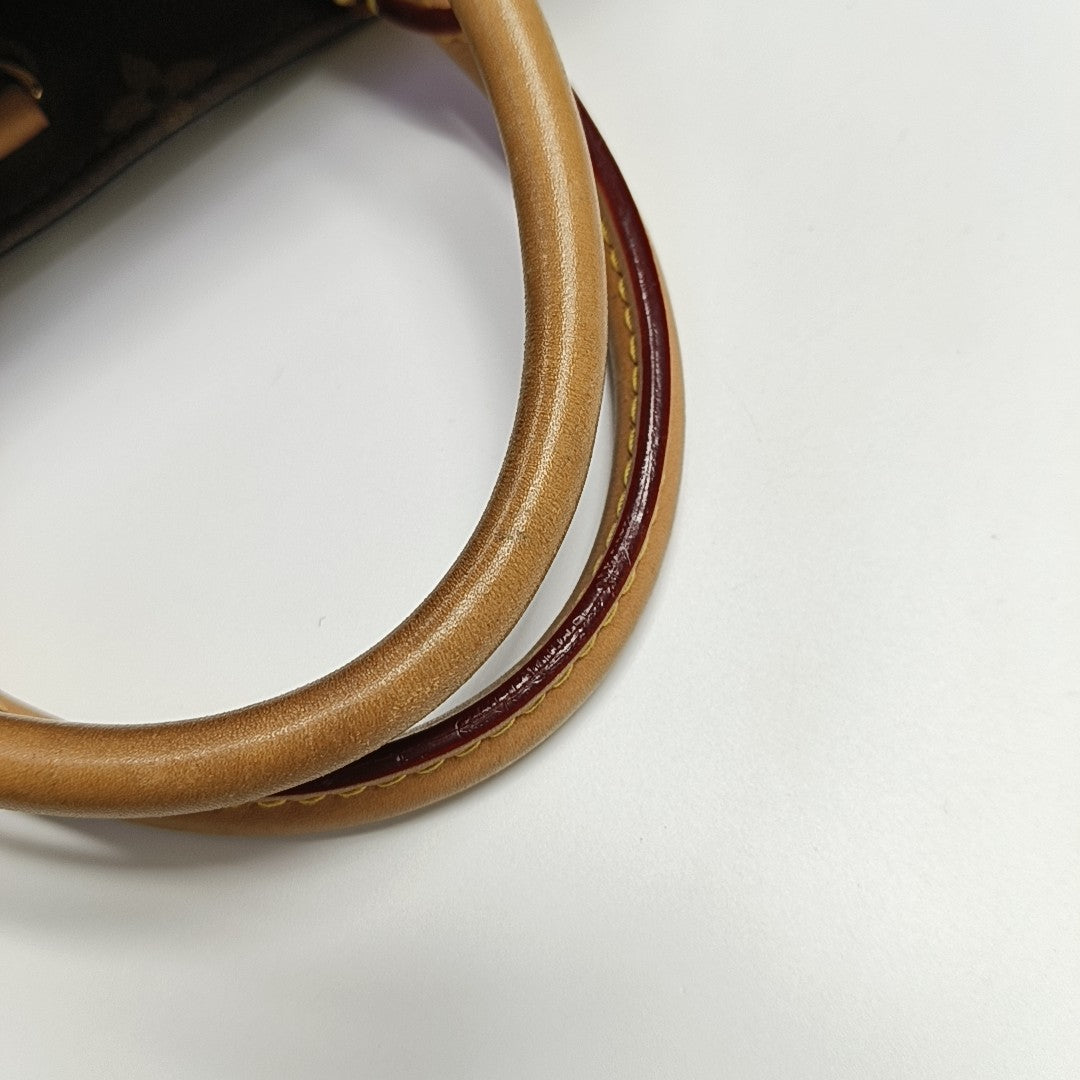 MONTAIGNE Monogram Coated Canvas Brown