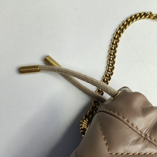 Authenticated pre-owned  GG Marmont Mini Quilted Calfskin Beige - Bucket Bag at Looply