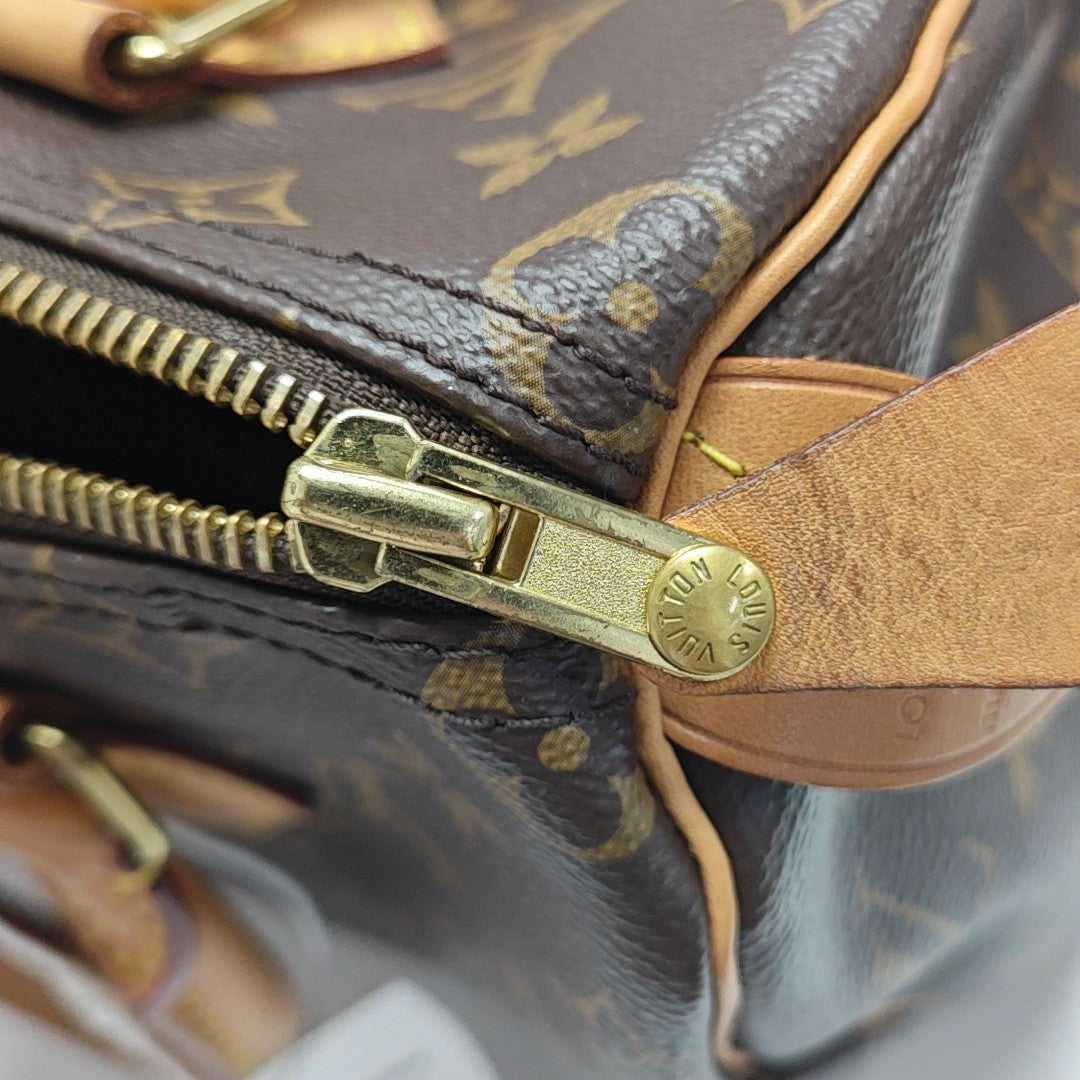 SPEEDY 25 Monogram Coated Canvas Brown