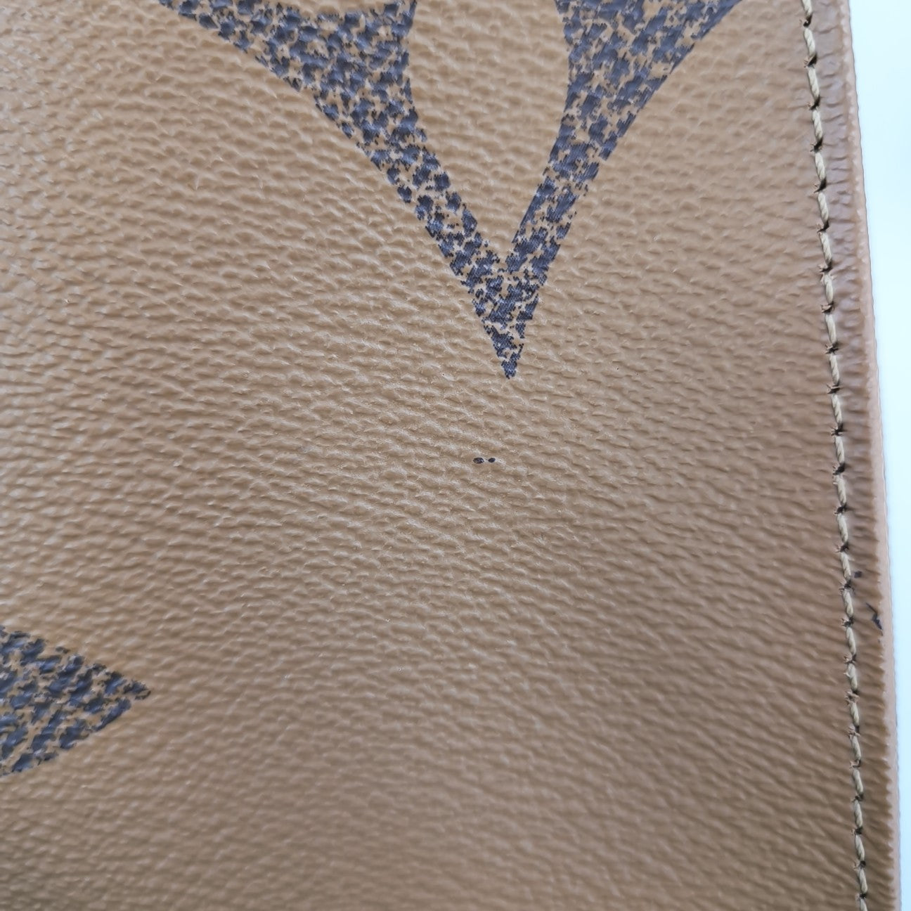 ONTHEGO MM Monogram Coated Canvas Brown