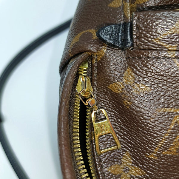 Authenticated pre-owned  PALM SPRINGS Mini Monogram Coated Canvas Brown - Backpack at Looply