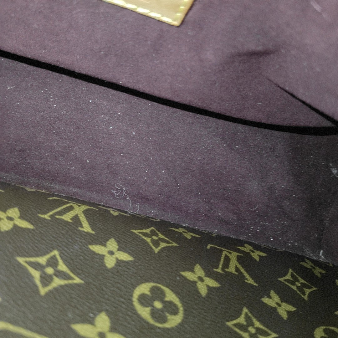 MONTAIGNE GM Monogram Coated Canvas Brown